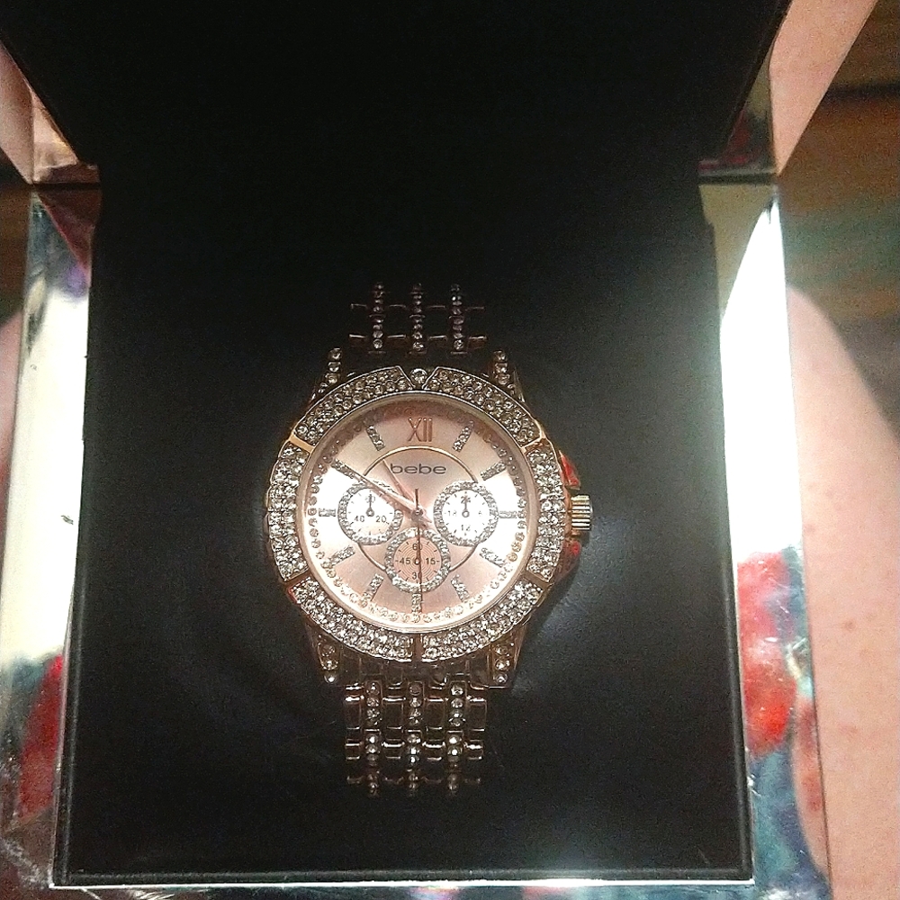 Rose gold colored Blinged out Bebe watch in black box